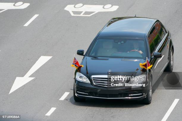 Motorcade carrying North Korean leader Kim Jong Un leaves Sentosa in Singapore, on Tuesday, June 12, 2018. Kim pledged to work toward complete...