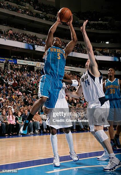 Marcus Thornton of the New Orleans Hornets goes to the rim against Eduardo Najera of the Dallas Mavericks during a game at the American Airlines...