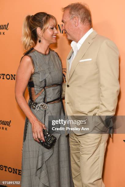 Christine Baumgartner and Kevin Costner attend the premiere of Paramount Pictures' "Yellowstone" at Paramount Studios on June 11, 2018 in Hollywood,...