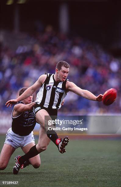 Paul Williams of the Magpies kicks during the round 15 AFL match between Collingwood and Geelong in Melbourne, Australia.