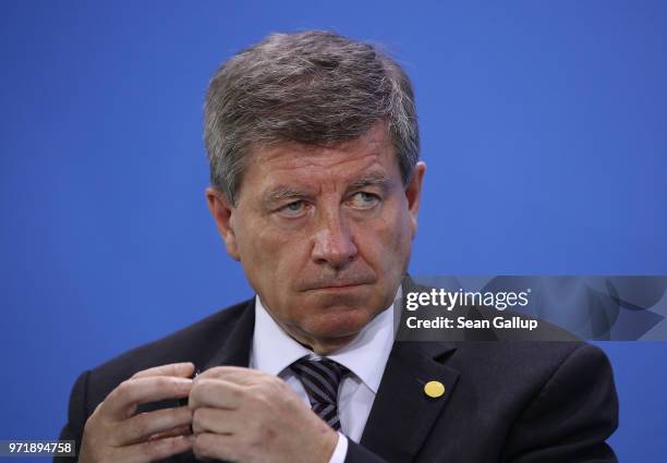 The International Labour Organization Director-General Guy Ryder attends a press conference following talks at the Chancellery on June 11, 2018 in...