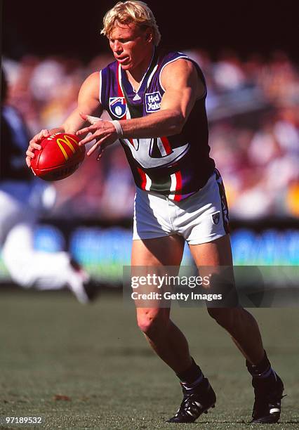 Clive Waterhouse of the Dockers kicks during the round 20 AFL match between Fremantle and Brisbane in Melbourne, Australia.