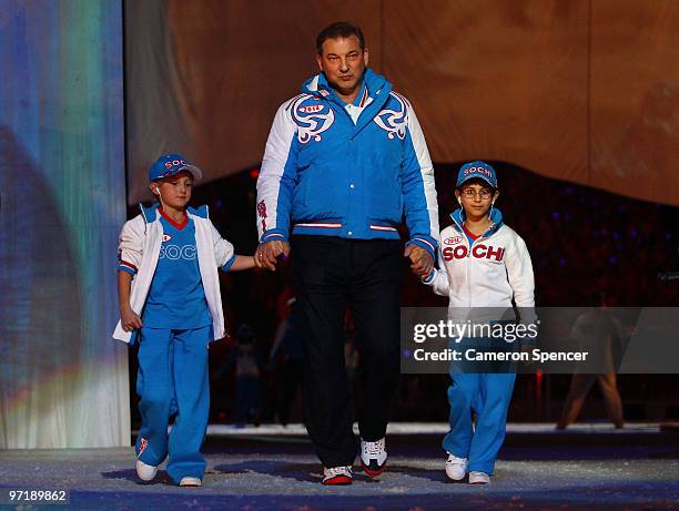 Representatives of the Winter Olympics in Sochi 2014 enter the stadium during the Closing Ceremony of the Vancouver 2010 Winter Olympics at BC Place...