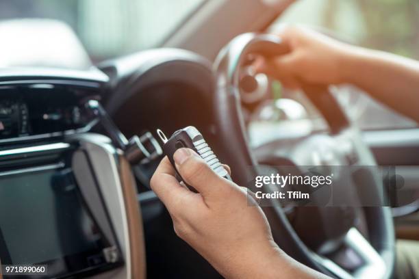 man hand on mobile radio in his car - walkie talkie stock pictures, royalty-free photos & images