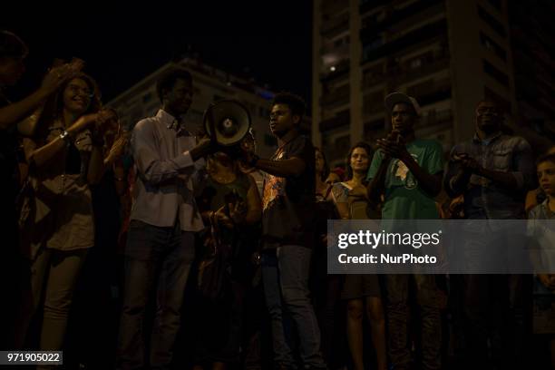 People take part in a protest against Italian Minister Matteo Salvini in Palermo, Italy, on June 12, 2018. The leader of the Lega Matteo Salvini, now...