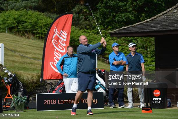 Tim Tisdall of Hever Castle Golf Club plays his first shot on the 1st tee during The Lombard Trophy South Qualifier at Camberley Heath Golf Club on...