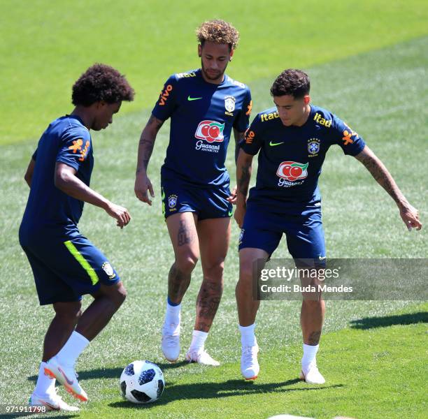 Neymar Jr; Willian and Philippe Coutinho of Brazil take part during a Brazil training session ahead of the FIFA World Cup 2018 at Yug-Sport Stadium...