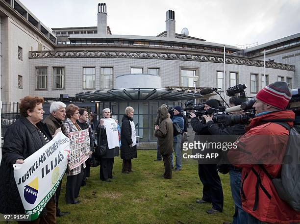 People demonstrate on March 1, 2010 outside the International Criminal Tribunal for the former Yugoslavia in The Hague, where the genocide trial of...