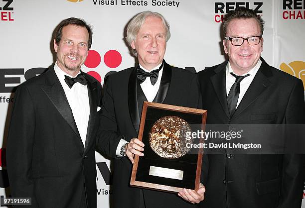 Actor Bill Paxton, director and VES Lifetime Achievement Award recipient James Cameron and actor Tom Arnold pose in the press room at the 8th Annual...