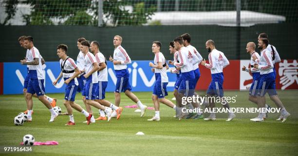 Players of the Russian national football team attend a training session in Novogorsk outside Moscow on June 12 ahead of the Russia 2018 World Cup...