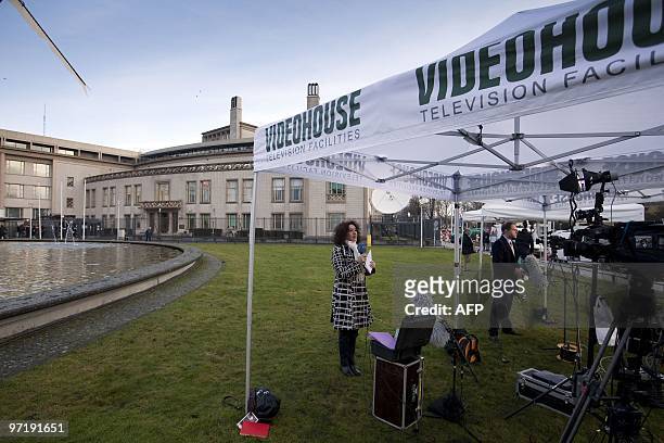 Journalists work on March 1, 2010 outside the International Criminal Tribunal for the former Yugoslavia in The Hague, where the genocide trial of...