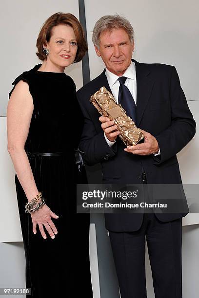 Actor Harrison Ford poses with Sigourney Weaver after he received Honour Cesar Award during 35th Cesar Film Awards at Theatre du Chatelet on February...