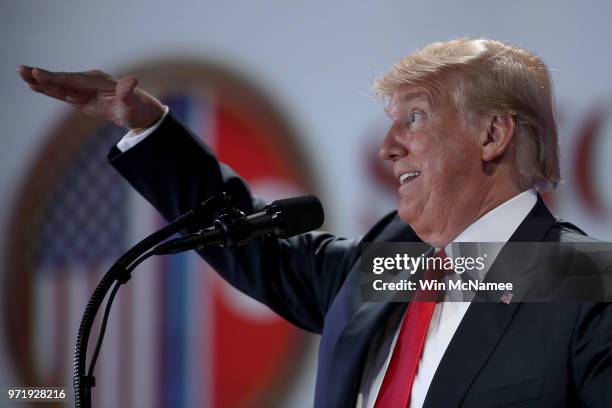 President Donald Trump answers questions during a press conference following his historic meeting with North Korean leader Kim Jong-un June 12, 2018...