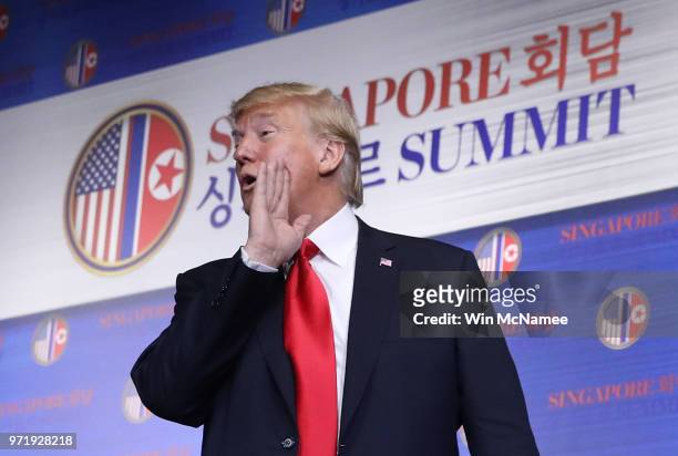 President Donald Trump answers a final question while departing a press conference following his historic meeting with North Korean leader Kim...