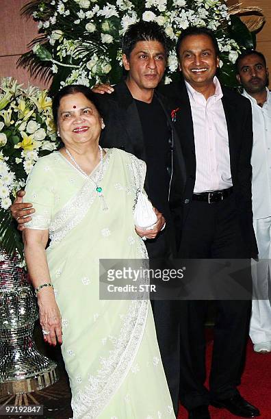 Indian Bollywood actor Shahrukh Khan is welcomed by Anil and Kokilaben Ambani at a soiree held by Head of Reliance Group of Industry Head Anil...