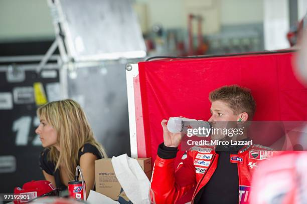 Casey Stoner and his wife Adriana of Australia and Ducati Marlboro Team look on in box during the day of testing at Sepang Circuit on February 26,...