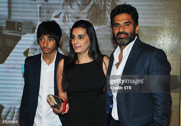 Indian Bollywood actor Sunil Shetty arrives with his family at a soiree held by Head of Reliance Group of Industry Head Anil Dhirubhai Ambani and his...