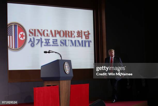 President Donald Trump arrives for a press conference following his historic meeting with North Korean leader Kim Jong-un June 12, 2018 in Singapore....