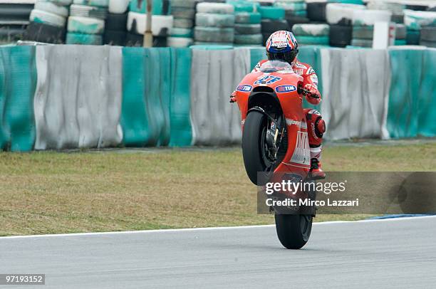 Casey Stoner of Australia and Ducati Marlboro Team lifts the front wheel during the day of testing at Sepang Circuit on February 26, 2010 in Kuala...