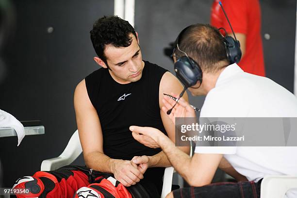 Hector Barbera of Spain and Team Aspar speaks in box during the day of testing at Sepang Circuit on February 26, 2010 in Kuala Lumpur, Malaysia.