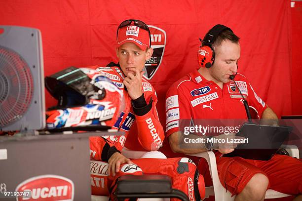 Casey Stoner of Australia and Ducati Marlboro Team looks on the monitor in box during the day of testing at Sepang Circuit on February 26, 2010 in...