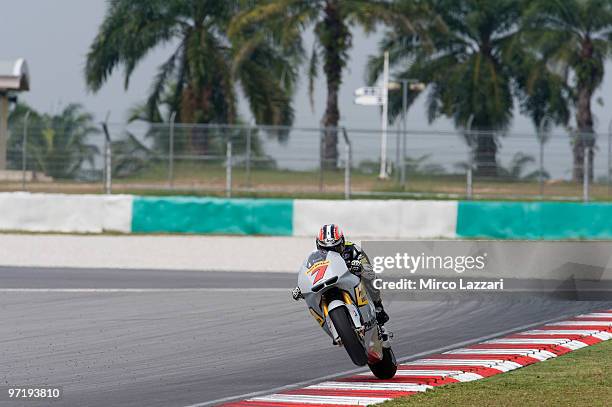 Hiroshi Aoyama of Japan and Interwetten MotoGP Team lifts the front wheel during the day of testing at Sepang Circuit on February 26, 2010 in Kuala...