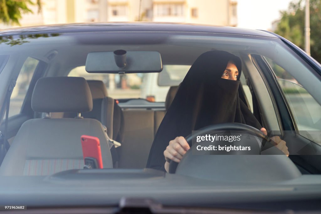 Muslim woman driving a car
