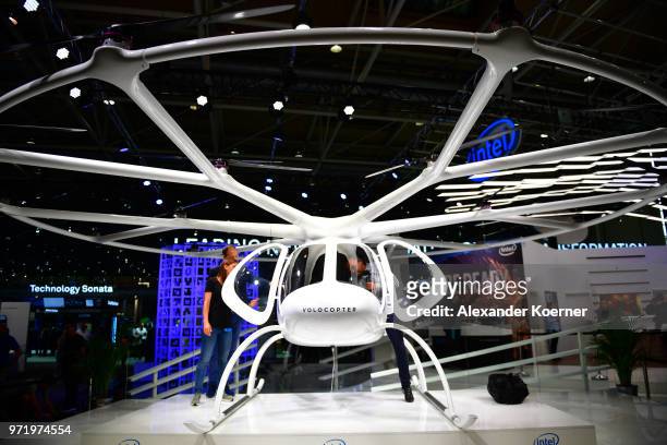 The Volocopter 2X, a fully electric helicopter powered by 18 turbines and produced by Intel is displayed at the Intel stand at the 2018 CeBIT...