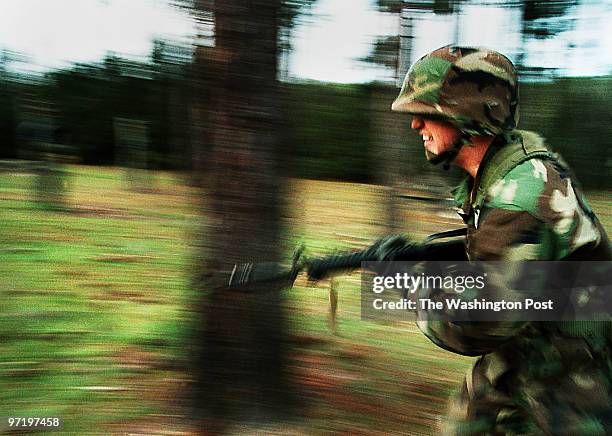 Marines Marine recruit David Fish rushes forward on the Combat Assault Resupply Course during the Crucible at Marine boot camp on Parris Island, SC.