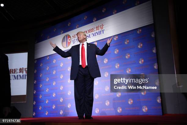 President Donald Trump answers a final question while departing a press conference following his historic meeting with North Korean leader Kim...