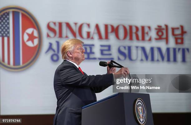 President Donald Trump answers questions during a press conference following his historic meeting with North Korean leader Kim Jong-un June 12, 2018...