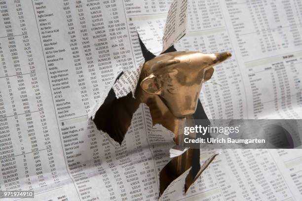 Symbol photo on the topics Bull , economy, economic situation, stock exchange, stock market numbers, upturn and downturn, etc. Bull breaks through...