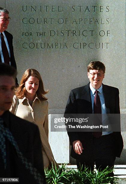 Gates Jahi Chikwendiu/TWP LEAD Bill Gates, with his wife, Melinda Gates, leaves the US District Court after testifying at anti-trust hearings,...