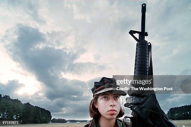 Marines Jahi Chikwendiu/TWP Candice Fleming waits for her turn at target practice on the firing range at Marine boot camp on Parris Island, SC. ORG...