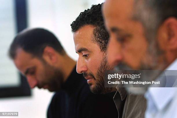 Tulkarem, West Bank 4/11/02 Issam Odeh center, sits with his father Mohammed Odeh, foreground, and remembers his brother Abdel-Bassatt who blew...