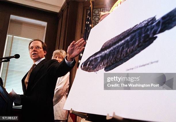 Snakehead Jahi Chikwendiu/TWP Eric Ruff, Director of Communications for the Office of the Secretary of Interior, motions toward a picture of the...