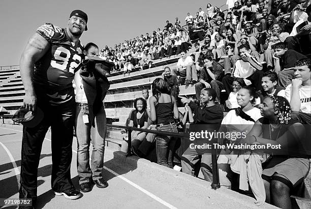 Cardoza high school, in NW DC, gets a new football field, courtesy of the Redskins and the Washington Post. Pictured, Redskin defensive tackle Daryl...