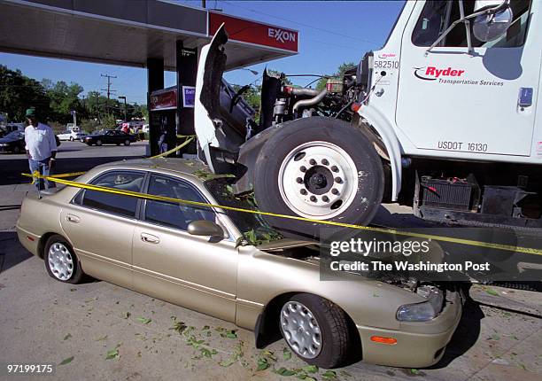 At the scene of an auto accident at the intersection of East-West highway and Riggs road this morning involving 7 vehicles, including a Ryder truck...