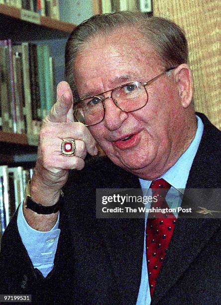 Morgan Wootten announces his retirement at an afternoon press conference at DeMatha. Pictured, Wootten cocks a finger at a supporter as he waits to...