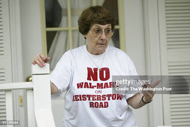 Woodwardt 134519 Opposition in Front Royal, VA., to a new Walmart. Mrs Ann McDermott stands on her front porch of her home. The proposed Walmart site...