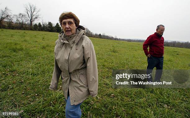 Woodwardt 134519 Opposition in Front Royal, VA., to a new Walmart. In this photo, retiree George McDermott and his wife Ann, walk in the site where...