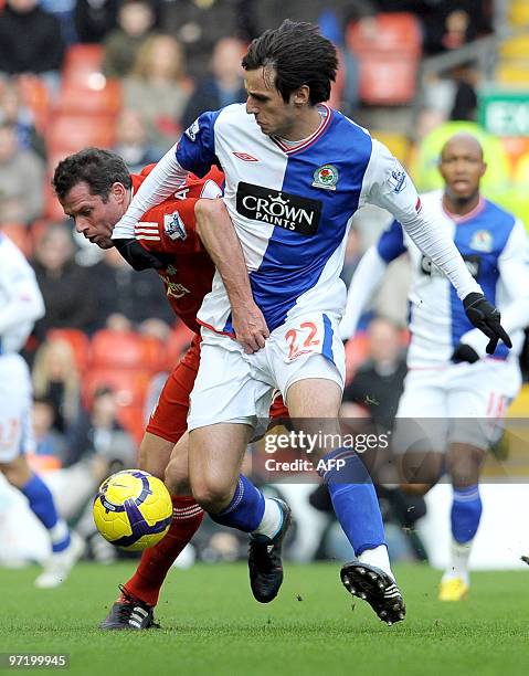 Liverpool's English defender Jamie Carragher vies with Blackburn Rovers' Croatian forward Nikola Kalinic during the English Premier League football...