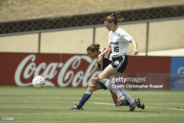Sherrill Kester of the San Diego Spirit tries to get past Chrisy McCann of the Boston Breakers during the second half of their WUSA match at Torrero...