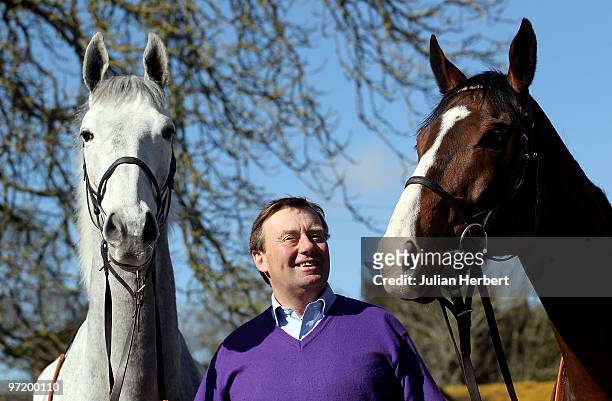 Racehorse trainer Nicky Henderson with Zaynar and Punjabi at an open day at his lambourn stables on March 1, 2010 in Lambourn, England. The horses...