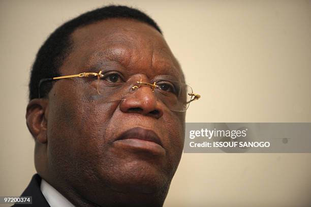 Former Ivorian Foreign Minister Youssouf Bakayoko listens to unidentified members of the electoral commission late on February 25, 2010 at the...