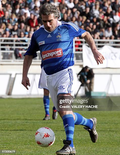 Former football player Dominique Rocheteau controls the ball during the "Luis Fernandez jubilee" football match, on February 28, 2010 at the...