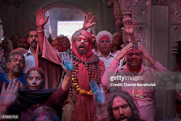 Hindu devotees play with colour during Holi celebrations at the Bankey Bihari Temple on March 01, 2010 in Vrindavan, India. The tradition of playing...