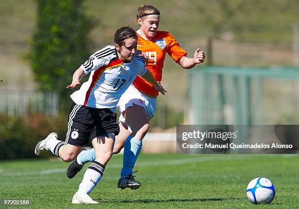 Nicole Rolser of Germany and Marissa Compier of Netherlands compete for the ball during the women's international friendly match between Germany and...