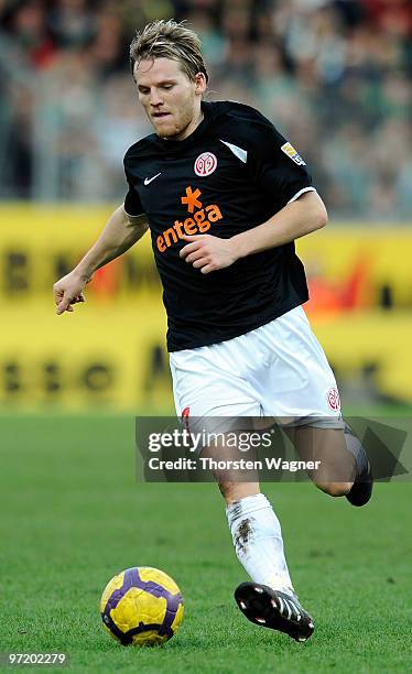 Eugen Polanski of Mainz runs with the ball during the Bundesliga match between FSV Mainz 05 and SV Werder Bremen at Bruchweg Stadium on February 27,...