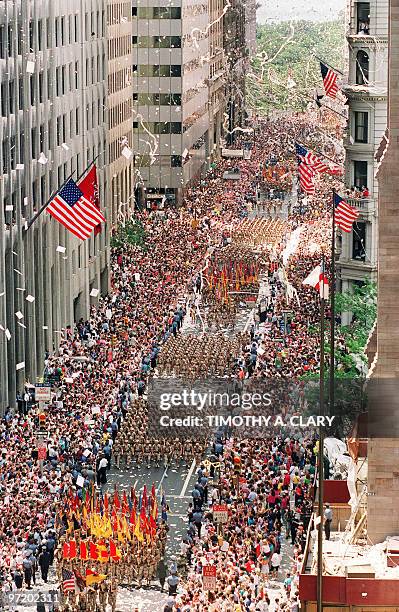 Thousands of Gulf War veterans are showered with ticker-tape as they march up Broadway Avenue during the Operation Welcome Home parade during the 10...